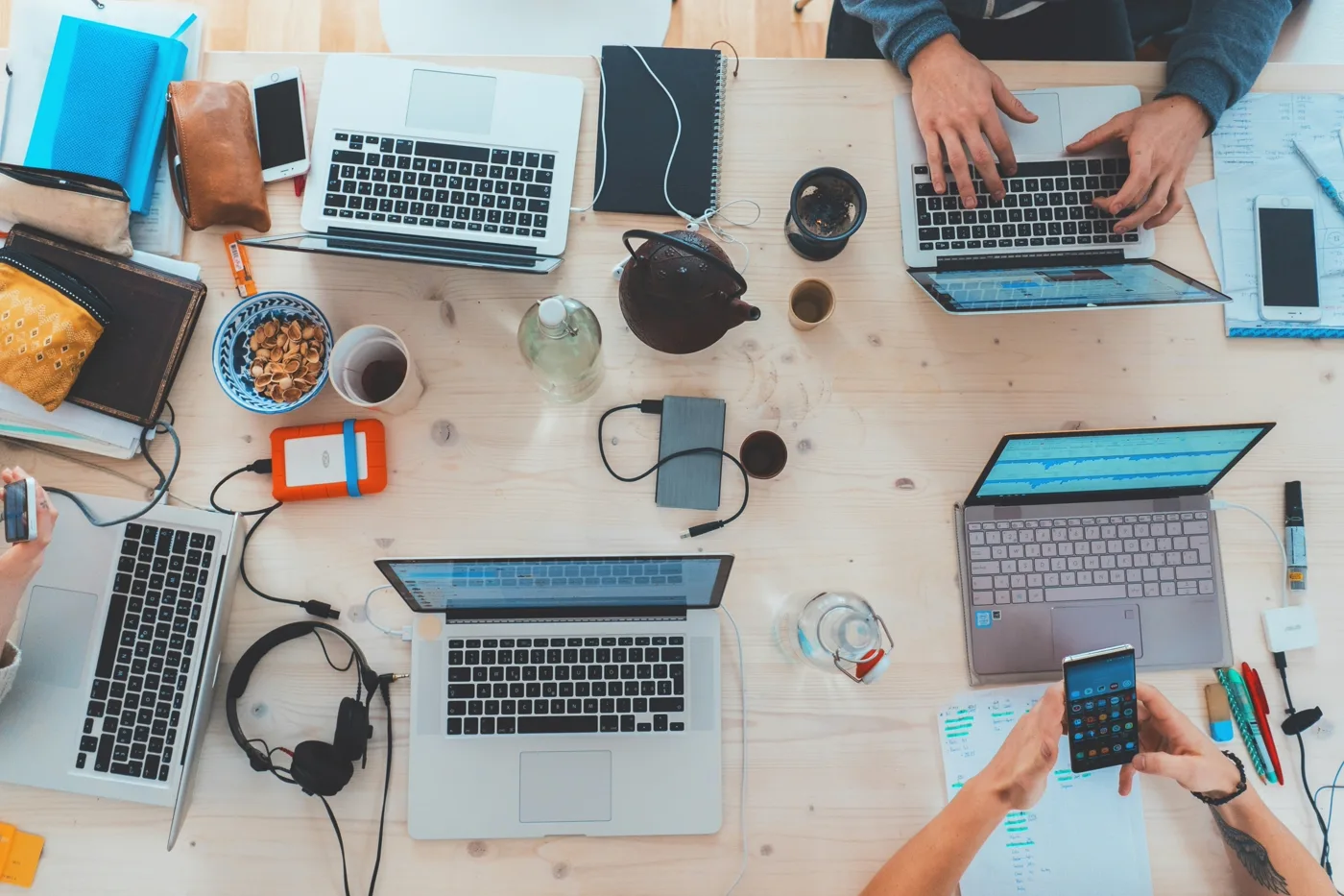 Development team monitoring hosting and deployment across multiple devices